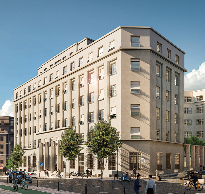 Modern beige multi-story office building with people walking and biking nearby on a sunny day.